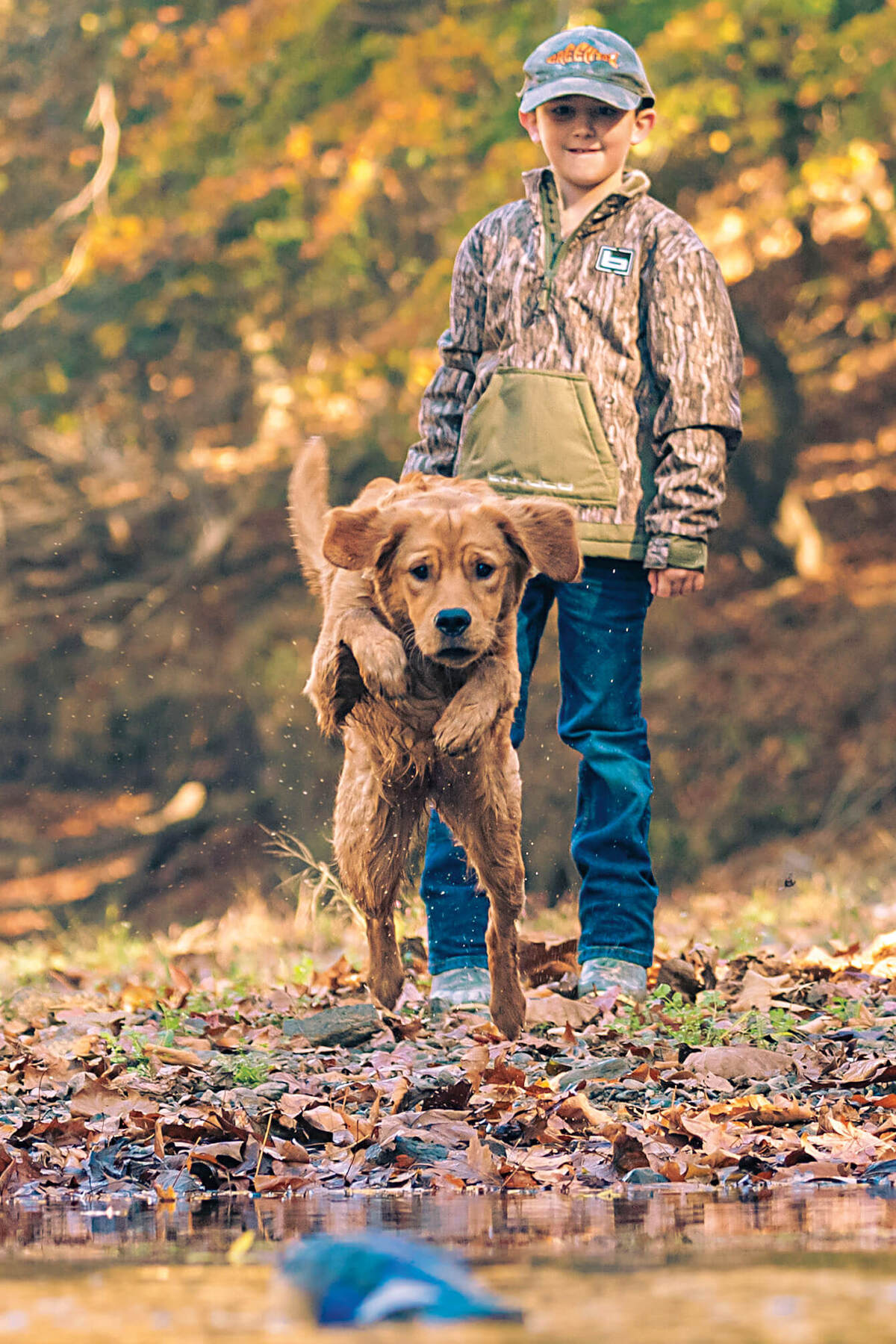 A child and retriever. Photo by Nicholas Mills